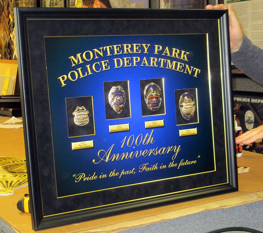 MPPD Badge History with
          printed backboard from Badge Frame